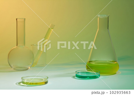 Laboratory concept with yellow and blue liquid contained inside some glassware. Science laboratory research and development concept 102935663