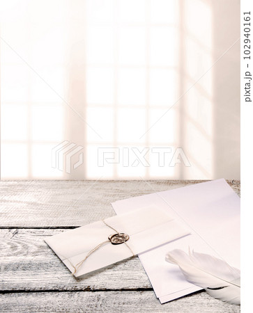 Envelope and paper with pen on the table 102940161
