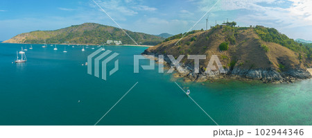 aerial panorama view above turquoise sea around Nui beach small beach surrounded by tourist attractions. Nui beach is the good place for swimming snorkeling and sea canoe. turquoise sea background. aerial panorama view above turquoise sea around Nui beach small beach surrounded by tourist attractions. Nui beach is the good place for swimming snorkeling and sea canoe. turquoise sea background. 102944346