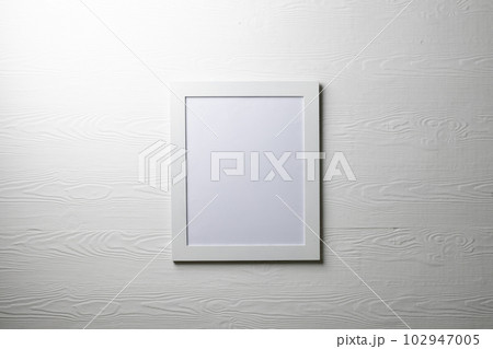 White empty frame with copy space on white wall White empty frame with copy space on white wall 102947005