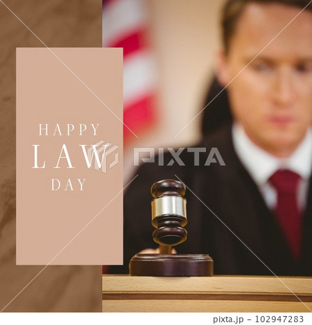 Composition of happy law day text with caucasian male judge holding gavel on brown background 102947283
