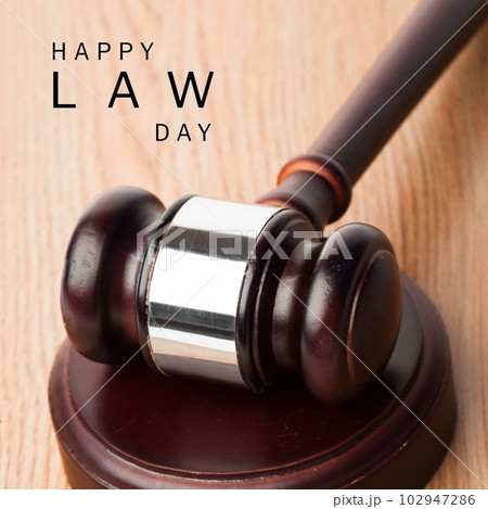 Composition of happy law day text with gavel on wooden background Composition of happy law day text with gavel on wooden background 102947286