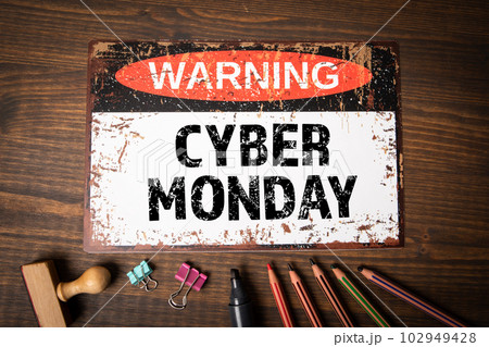 Cyber Monday. Warning sign with text on wood texture background 102949428