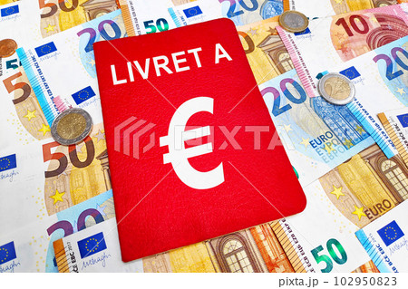 Livret A passbook atop of a stack of Euros Livret A passbook atop of a stack of Euros 102950823