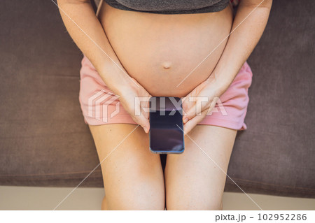 Pregnancy mockup app. Mobile pregnancy online maternity application. Pregnant mother using phone mock up. Pregnancy, medicine, pharmaceutics, health care and people concept Pregnancy mockup app. Mobile pregnancy online maternity application. Pregnant mother using phone mock up. Pregnancy, medicine, pharmaceutics, health care and people concept 102952286