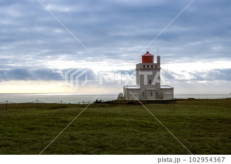 Dyrholaey Lighthouse and cloudy sky, Iceland Dyrholaey Lighthouse and cloudy sky, Iceland 102954367