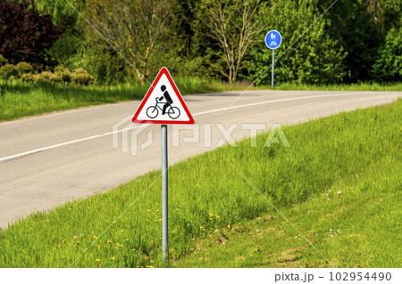 Bicycle traffic sign on a country road Bicycle traffic sign on a country road 102954490