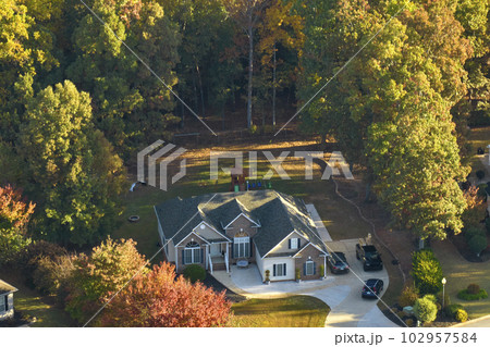 Aerial view of classical american home in South Carolina residential area. New family house as example of real estate development in USA suburbs 102957584