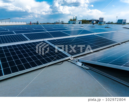 Close-up of Solar cell farm power plant eco technology. Landscape of Solar cell panels in a photovoltaic power plant. Concept of sustainable resources and renewable energy.blue tone. Close-up of Solar cell farm power plant eco technology. Landscape of Solar cell panels in a photovoltaic power plant. Concept of sustainable resources and renewable energy.blue tone. 102972804