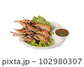 grilled shrimp on a plate served with spicy sauce 102980307