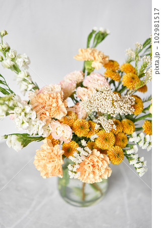 Finished flower arrangement in a vase for home. Flowers bunch, set for interior. Fresh cut flowers for decoration home. European floral shop. Delivery fresh cut flower. Finished flower arrangement in a vase for home. Flowers bunch, set for interior. Fresh cut flowers for decoration home. European floral shop. Delivery fresh cut flower. 102981517