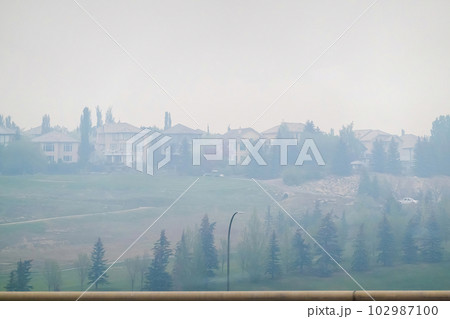 Calgary, Alberta, Canada. May 18, 2023. Panorama hills neighbourhood, view of the poor quality air due to wildfires. Concept Calgary, Alberta, Canada. May 18, 2023. Panorama hills neighbourhood, view of the poor quality air due to wildfires. Concept 102987100