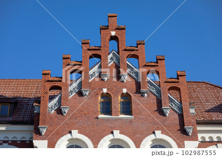 Topping the gable wall of a historic building in the Neo-Gothic style. Topping the gable wall of a historic building in the Neo-Gothic style. 102987555