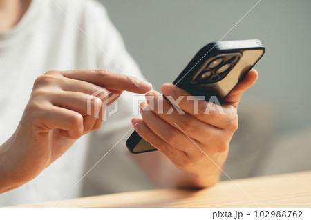 Young Man using mobile smart phone. 102988762