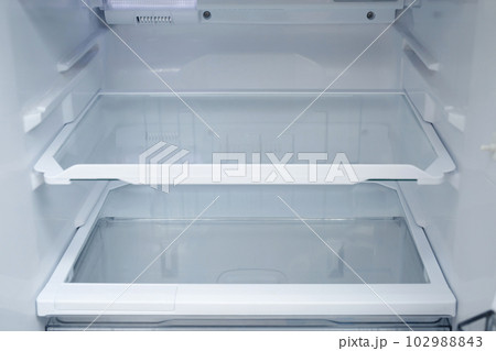 Interior view of the shelf of the refrigerator at home Interior view of the shelf of the refrigerator at home 102988843