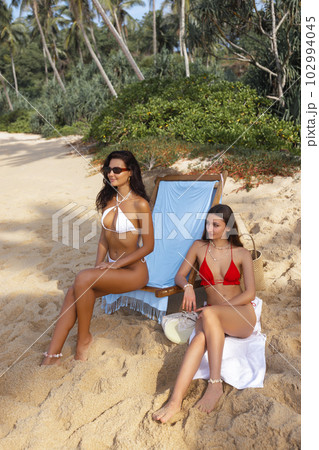 Summer Vacation of Two Beach Girls in Bikini, Friendship and Enjoyment 102994045