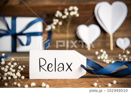 Label With White Heart Decoration, Flower, Gift, Text Relax 102998010