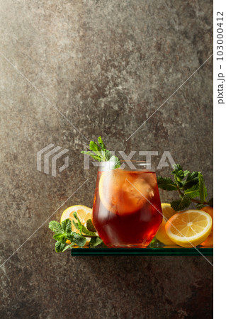 Iced tea with ice, lemon, and mint. 103000412
