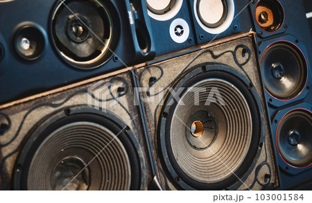 A full-frame wall of old retro speaker cones background concept for music and audio industry 103001584