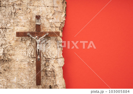 Christian Pentecost. Whit Sunday. A cross with a birch branch on a white, green, red and black background. Christian Pentecost. Whit Sunday. A cross with a birch branch on a white, green, red and black background. 103005884