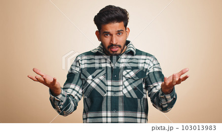 Man raising hands in indignant expression ask why what reason of failure demonstrating disbelief Man raising hands in indignant expression ask why what reason of failure demonstrating disbelief 103013983