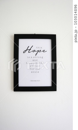 A photo of a frame that reads a bible verse in Hebrew 6 103014896