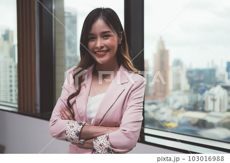 Portrait businesswoman in modern office among business officer people Portrait businesswoman in modern office among business officer people 103016988