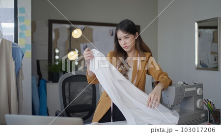 Female dressmaker creating sketch line of new fashionable style 103017206