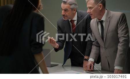 Senior business officer team consulting together new project Senior business officer team consulting together new project 103017491