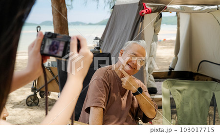 Happy Asian family with barbecue party at camping beach together 103017715