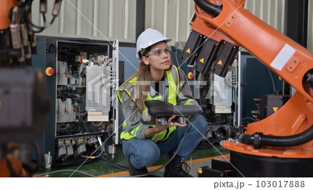 Maintenance engineer worker working with robotic machine at factory Maintenance engineer worker working with robotic machine at factory 103017888