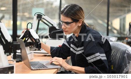 Professional female engineer technician working with robot maintenance 103017901