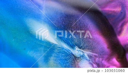 Blue purple liquid abstract background. Slow motion fluid art splash. Brilliant blue lilac paint spreads sparkling with glitter. Golden particles sparkle in colorful blue-purple watercolor backdrop Blue purple liquid abstract background. Slow motion fluid art splash. Brilliant blue lilac paint spreads sparkling with glitter. Golden particles sparkle in colorful blue-purple watercolor backdrop 103031060