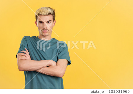 Gay man crossing the arms with an angry expression Gay man crossing the arms with an angry expression 103031969
