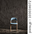 Blue fabric dining chair against dark stucco wall. 3d rendering 103034072