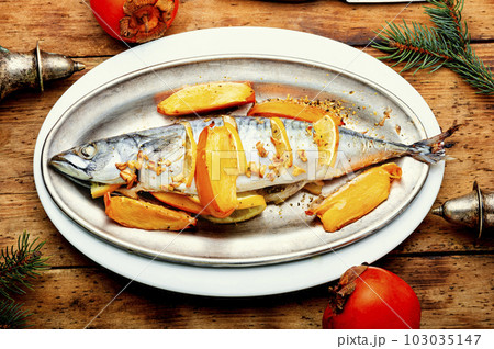 Mackerel fish baked with fruits. 103035147