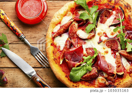 Homemade meat pizza with figs. 103035163