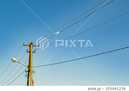 Power electric pole with line wire on colored background close up Power electric pole with line wire on colored background close up 103041236