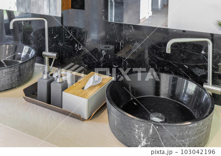 bathroom with black marble sink and marble wall bathroom with black marble sink and marble wall 103042196