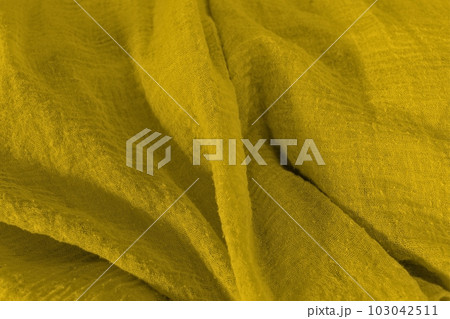 close-up of yellow colorful fabric surfaces. close-up of yellow colorful fabric surfaces. 103042511