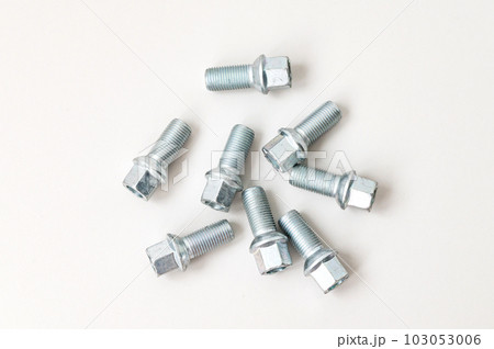 The wheel bolt is on the table. New metal bolt The wheel bolt is on the table. New metal bolt 103053006