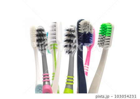 Close up Pile of Used and Dirty Toothbrush on iSolated White Background, Unhealthy Oral Health Care Equipment 103054231