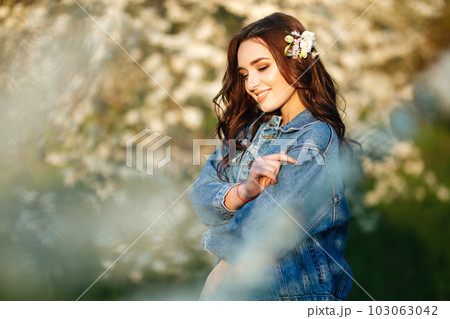 Portrait of a beautiful bride. Wedding concept. Stylish wedding. Great sunset light. Spring garden. Portrait of a beautiful bride. Wedding concept. Stylish wedding. Great sunset light. Spring garden. 103063042