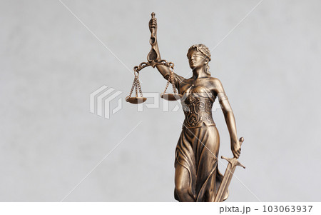 themis is goddess of justice statuette on dark background. symbol of law with scales themis is goddess of justice statuette on dark background. symbol of law with scales 103063937