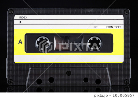 Yellow labeled retro vintage compact cassette A - side on black Yellow labeled retro vintage compact cassette A - side on black 103065957