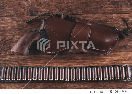 Colt Revolver and gunbelt with holster. Colt Revolver and gunbelt with holster. 103065970