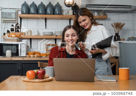 Two girls watching laptop. Watch Video Play social media, vacation getaway Two girls watching laptop. Watch Video Play social media, vacation getaway 103068748