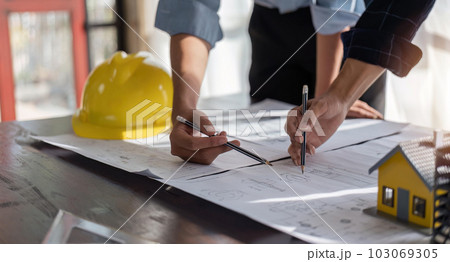 engineer team planning design house, modifying plan, creating construction project and addition according to customer requirement 103069305