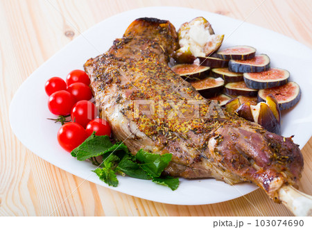 Baked lamb shoulder with figs, tomatoes, feta Baked lamb shoulder with figs, tomatoes, feta 103074690