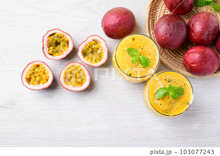 Fresh passion fruit smoothie drink in summer season, Table top view 103077243